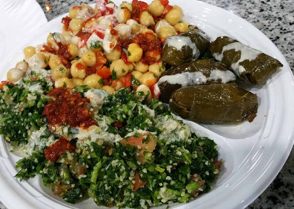 Plate of tabouli, chickpeas and grape leaves from Oasis in Brooklyn.